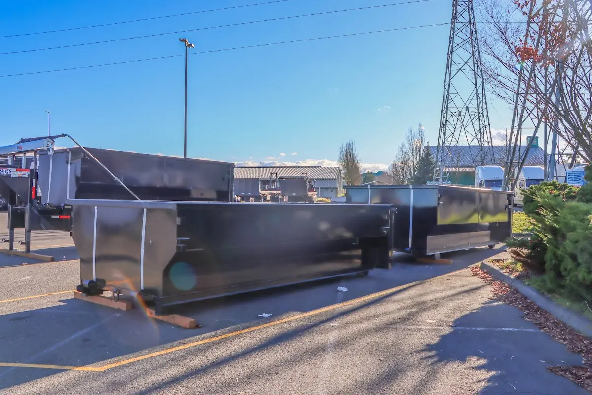 Roll-off dumpster ready for waste disposal at job site for Concrete Dumpster Rental in Tichigan